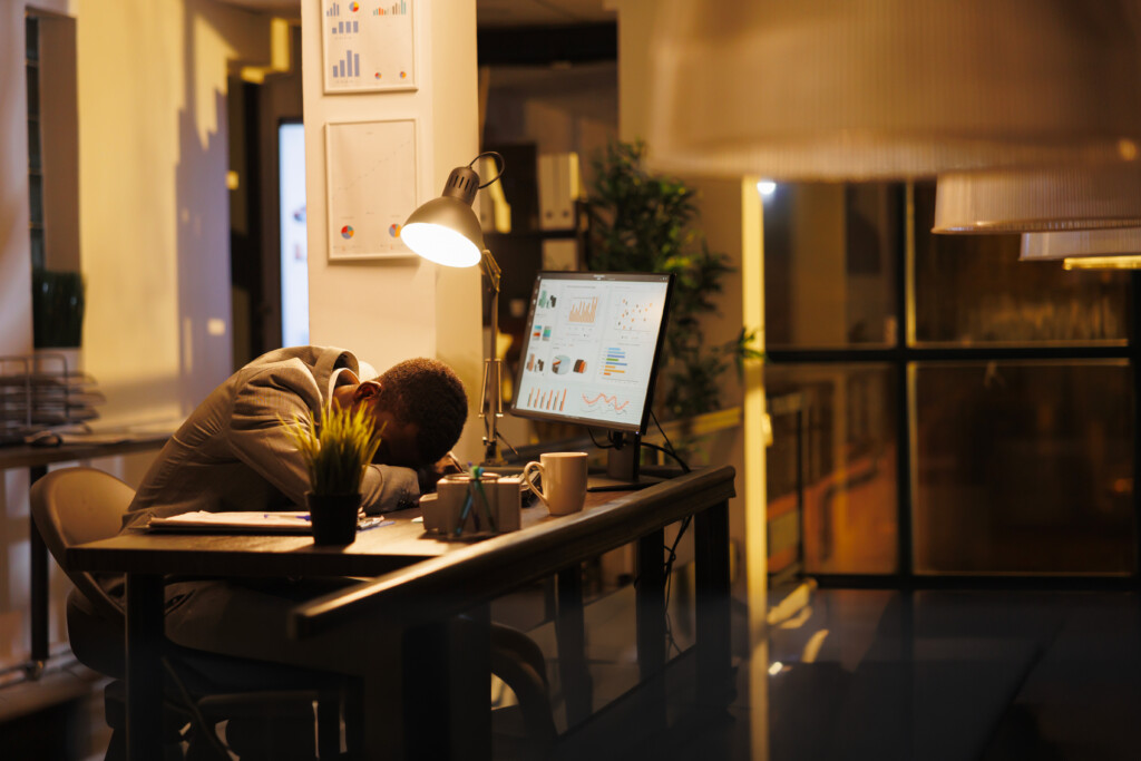 tired-drained-entrepreneur-sleeping-desk-startup-office