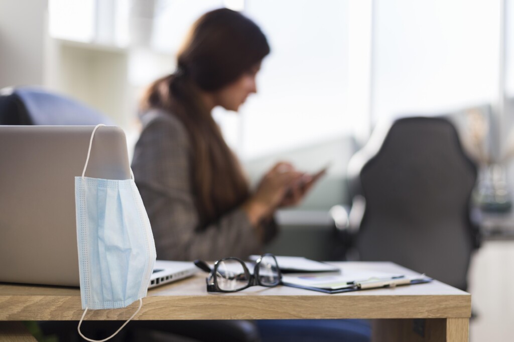 side-view-defocused-businesswoman-woman-desk