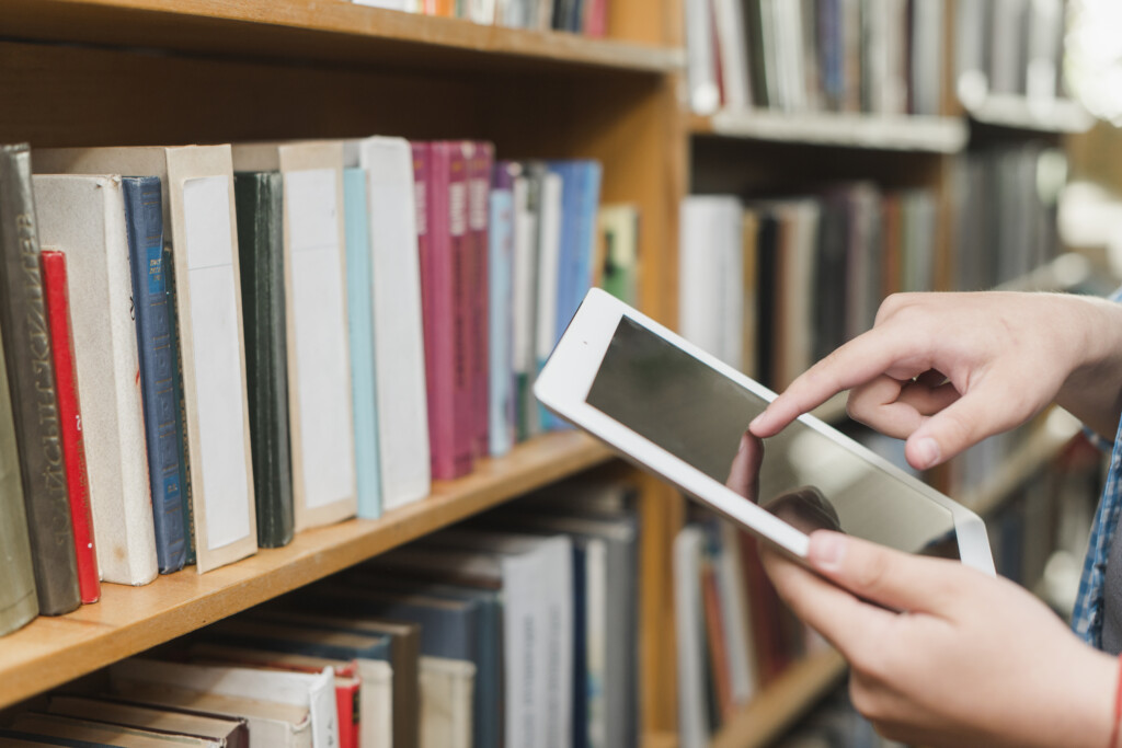 crop-hands-using-tablet-library