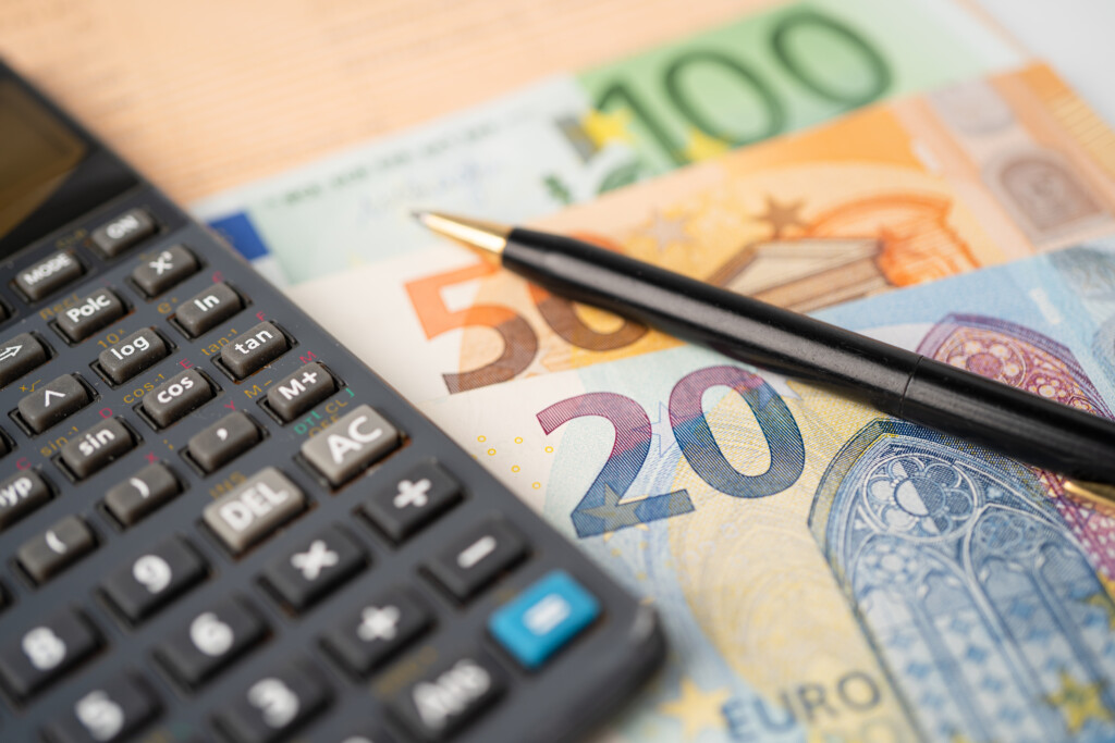 euro-banknotes-money-with-calculator-chart-graph-paper-financial-development-banking-account-statistics-investment-analytic-research-data-economy-trading-business-company-concept