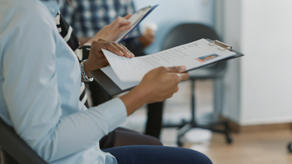 female-candidate-sitting-queue-receiving-cv-files-waiting-start-job-interview-about-career-opportunity-woman-getting-ready-attend-recruitment-meeting-with-hr-employee