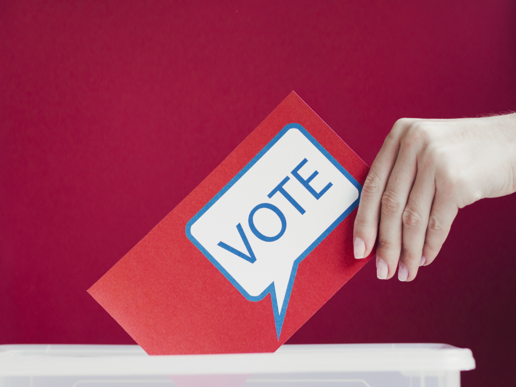 close-up-red-card-with-voting-speech-bubble