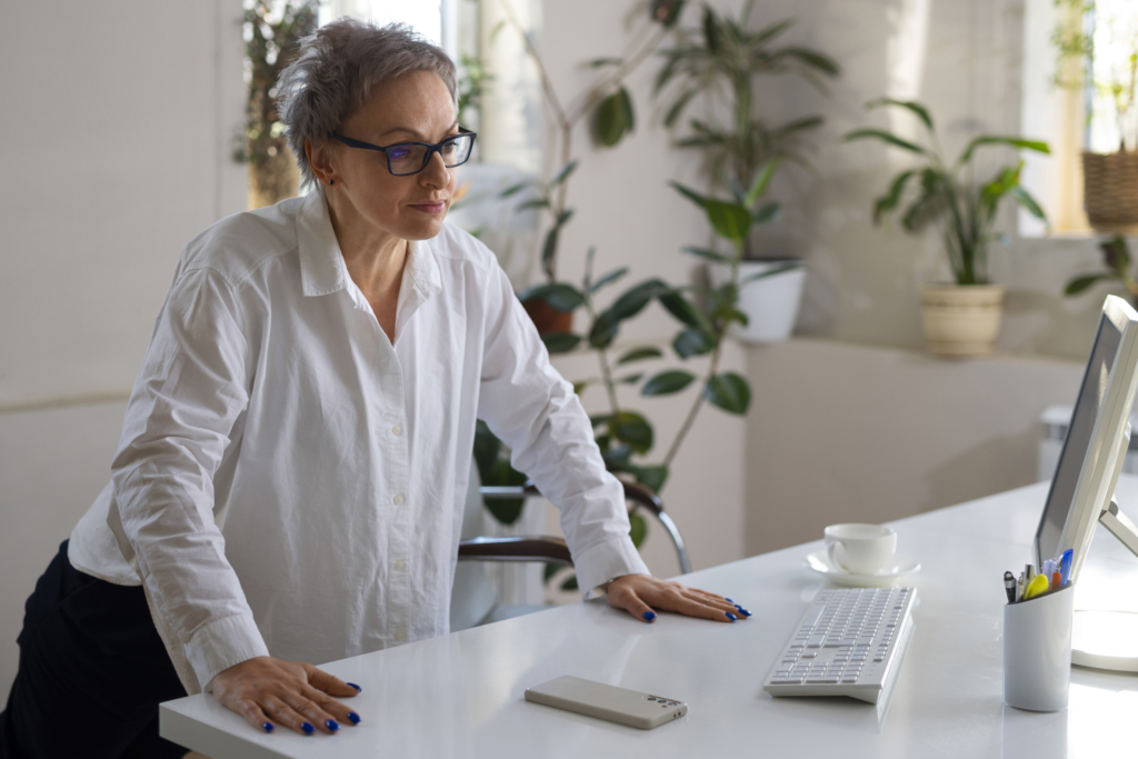 medium-shot-woman-sitting-desk